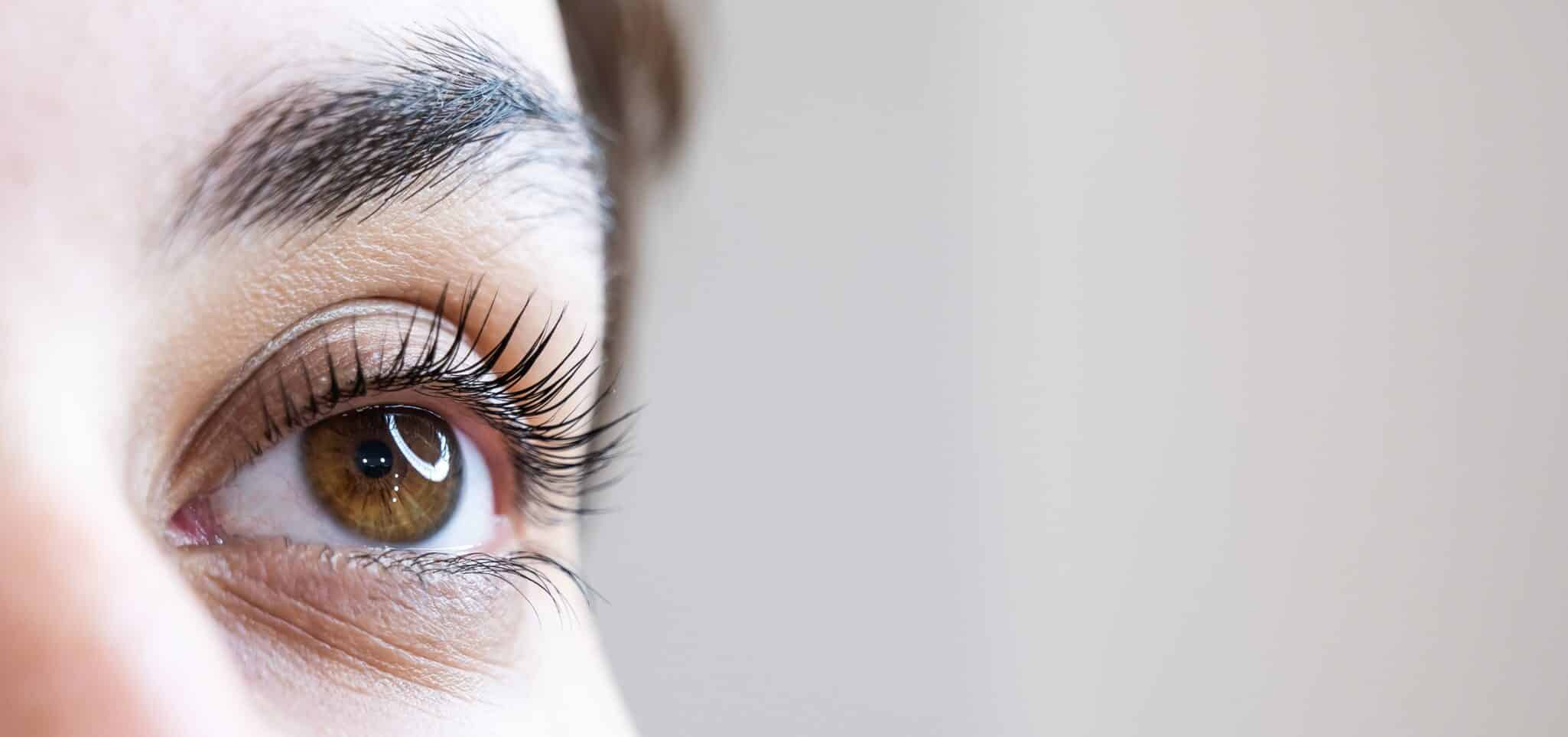 Close up of a pretty brown eye with long, dark lashes after getting LATISSE treatment.