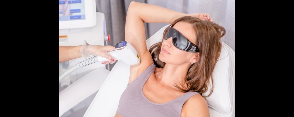 Woman having her underarm hair laser removed for lower maintenance, longer-lasting smooth skin.